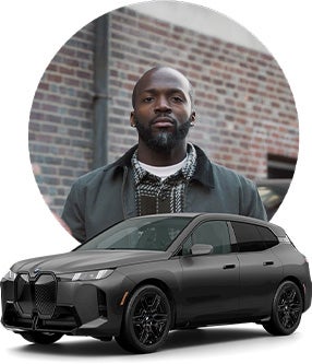 Image of John and his BMW Model.